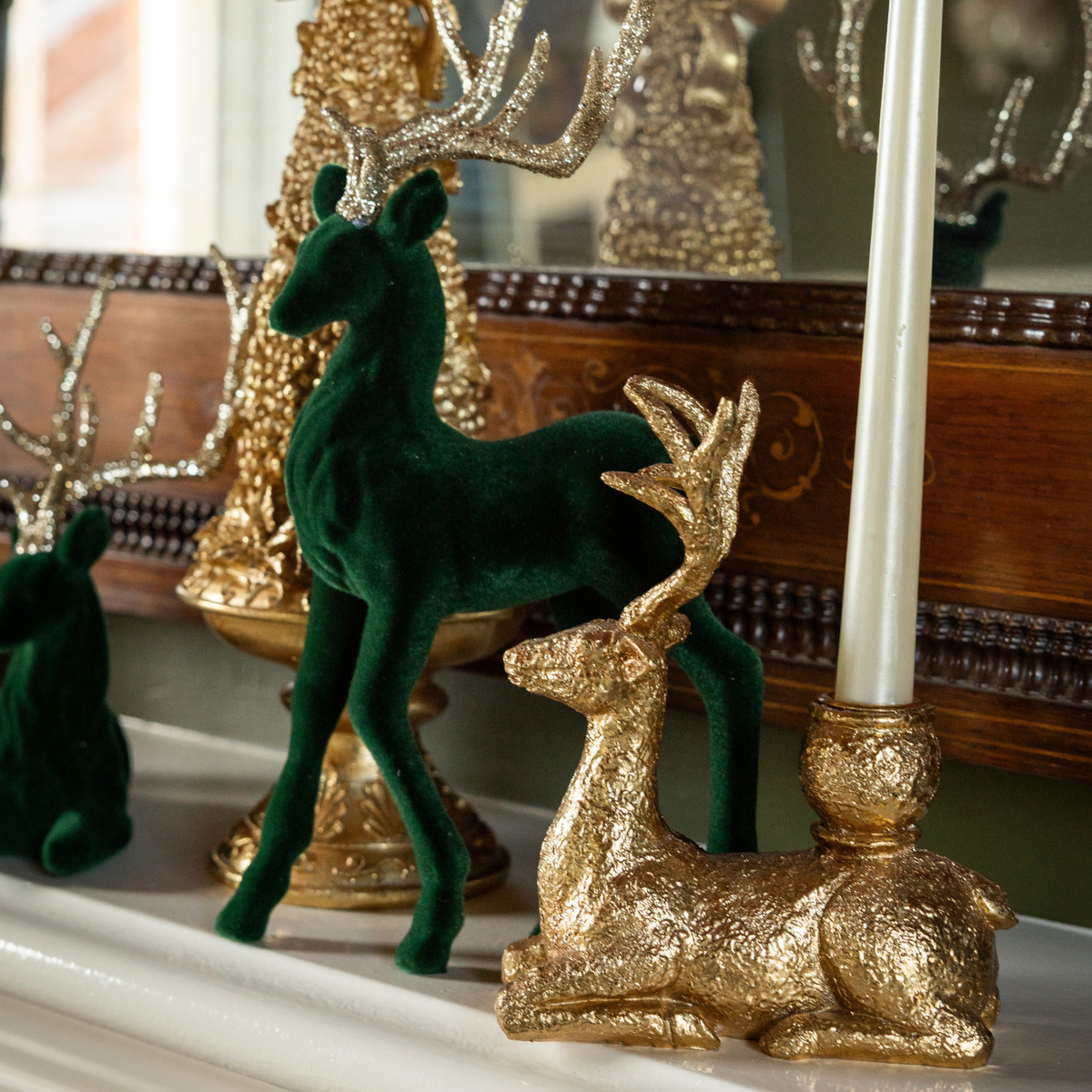 Green and Black Plaid Christmas table styled with dark green velvet reindeer and gold deer candle holders