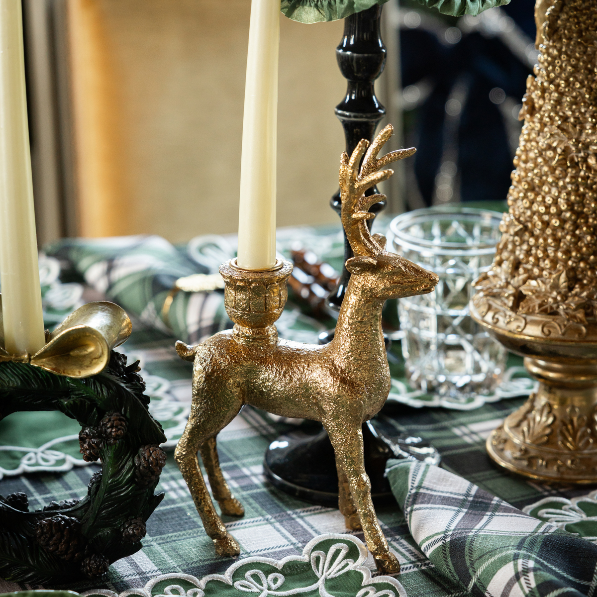 Green and Black Plaid Christmas table styled with gold deer candle holders