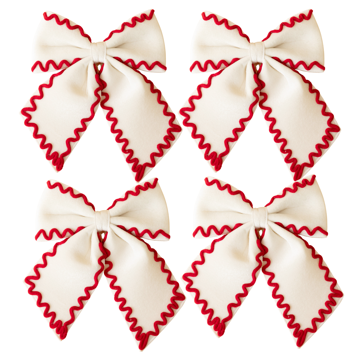 Set of four cream bows with red ric rac trim
