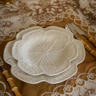 Gold Toile Christmas table styled with white cabbage plates and gold placemats with ivory embroidery