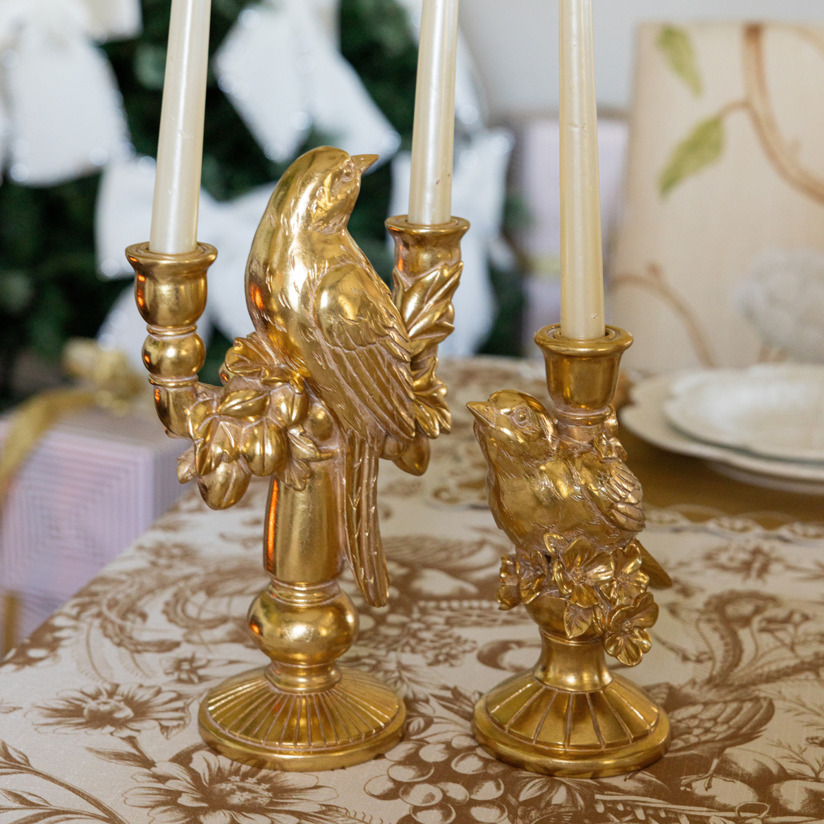 Gold Toile Christmas table styled with gold bird double candle holder and gold bird candle holders